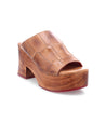 A women's brown leather mule with a wooden sole and an open-toe design by Bed Stu.