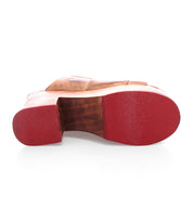 A pair of Vanquish shoes with red soles and an open-toe design on a white background. Brand: Bed Stu.