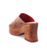 A women's sustainable fashion wooden mule with an open-toe design and a red heel from Bed Stu's Vanquish collection.
