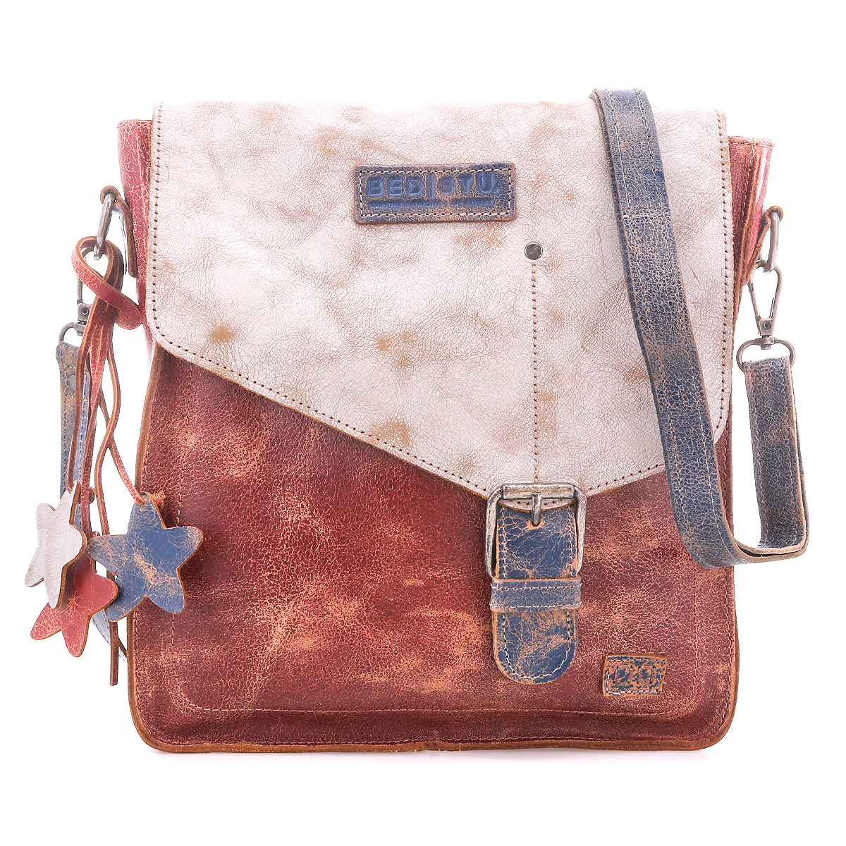 The Venice Beach by Bed Stu is a square crossbody bag made from full-grain leather in a distressed brown and white finish, featuring a front buckle, star-shaped charms, and an adjustable strap for versatile styling.