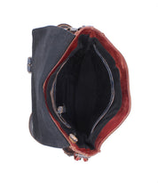 Overhead view of the Bed Stu Venice Beach crossbody bag with a black exterior, brown lining, and multiple compartments. Features an adjustable strap for comfortable wear.