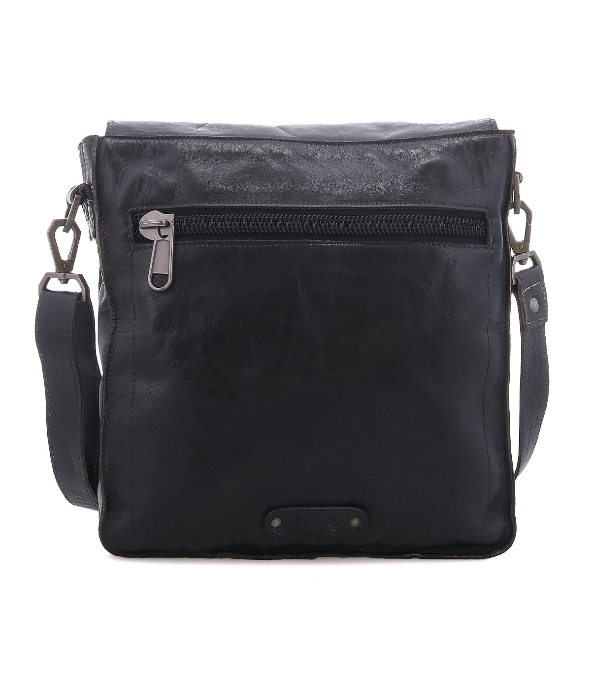 The Bed|Stü Venice Beach is a black full-grain leather crossbody with a front zipper pocket, adjustable strap, and a small rectangular patch at the bottom center.