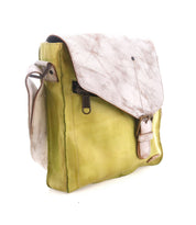 The Bed Stu "Venice Beach" handmade leather crossbody bag features a bohemian design with a green leather body, light brown textured flap, buckle detail, and side zipper pocket—perfect for strolling through Venice Beach!.
