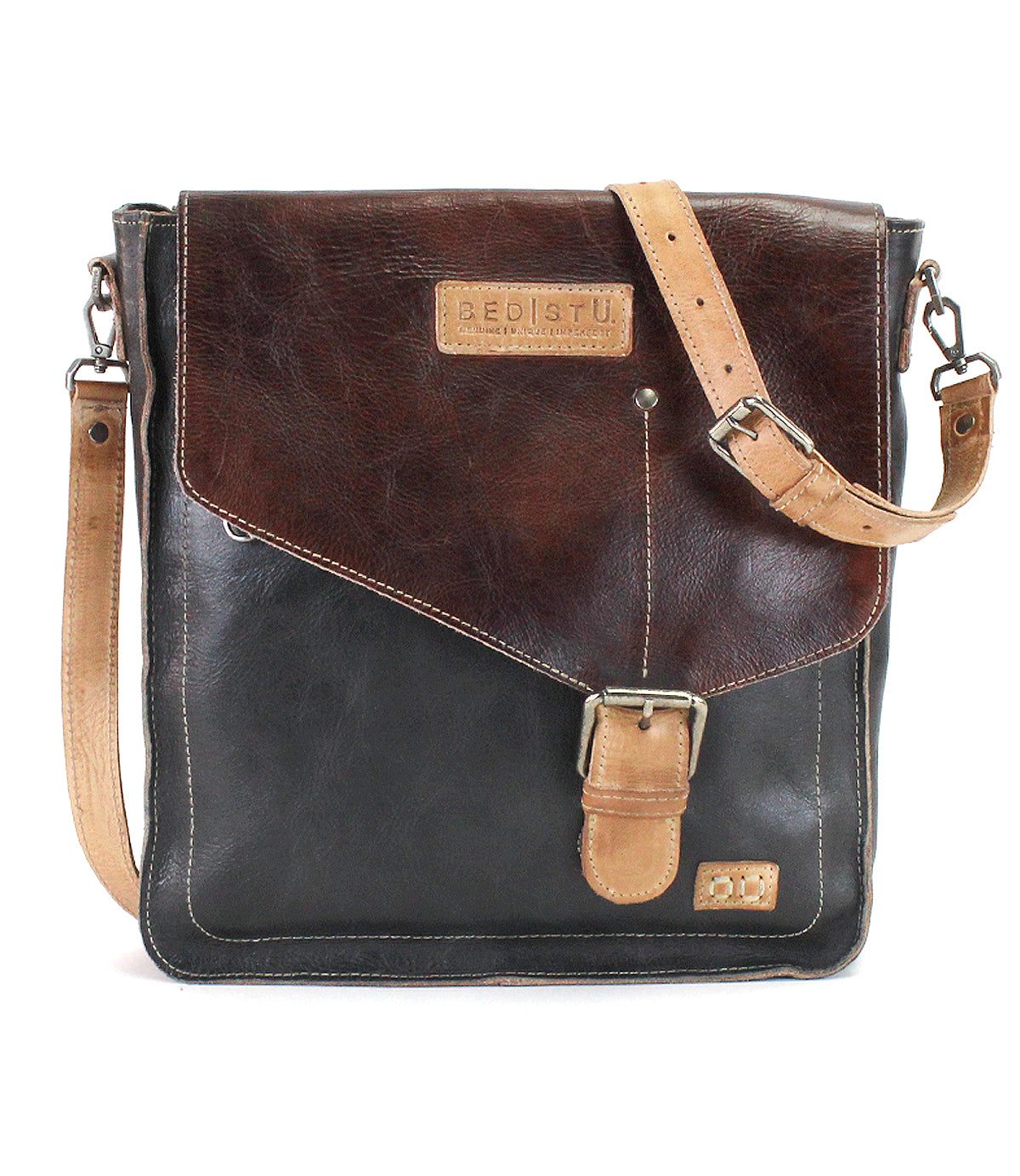 The Venice Beach messenger bag by Bed|Stü is crafted from durable full-grain leather and features a square silhouette with a dark brown flap, tan buckle strap, and an adjustable tan shoulder strap. The brand “Bed|Stü” is embossed on a patch on the flap, emphasizing the versatility of this crossbody bag.
