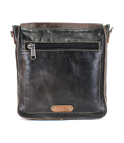 Introducing the Venice Beach by Bed|Stü—a black full-grain leather crossbody bag with brown accents, featuring a front zippered pocket and finished with a small rectangular leather patch stamped with text near the bottom.