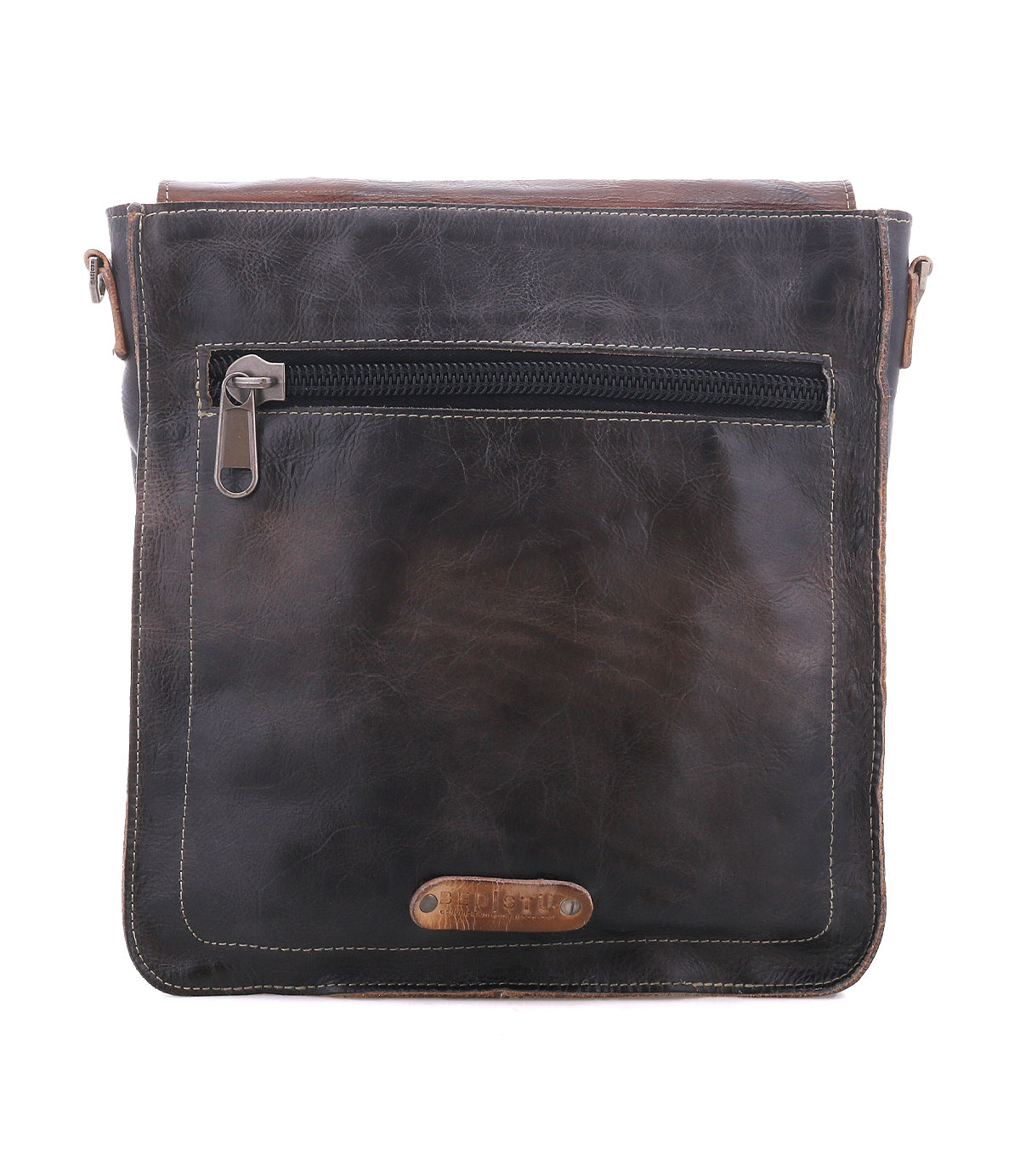 Bed|Stü Venice Beach dark brown full-grain leather messenger bag with an adjustable strap, a horizontal zippered pocket, and a small metal logo plate at the bottom.