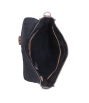 Open black full-grain leather Bed|Stü Venice Beach crossbody bag with a tan interior lining, viewed from above.