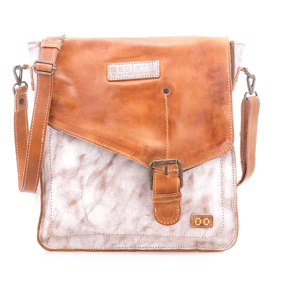 The Bed Stu Venice Beach is a brown and white full-grain leather crossbody bag featuring a front buckle, adjustable shoulder strap, and a visible brand patch on the flap.