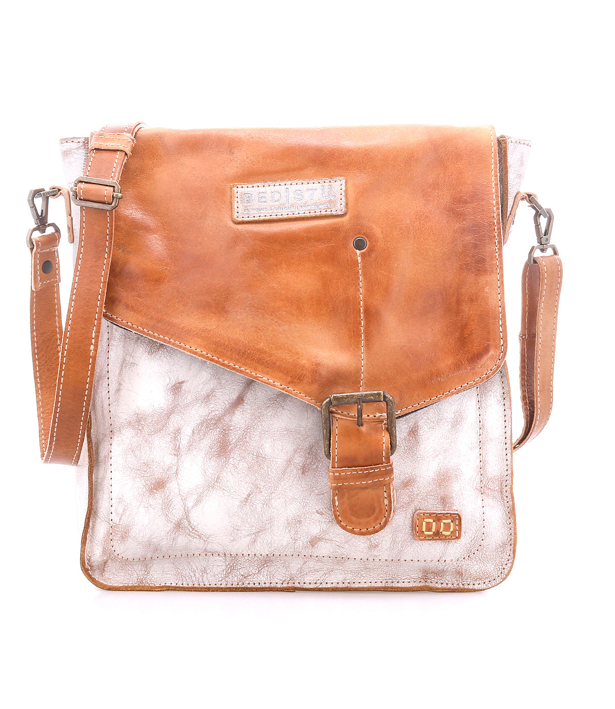 The Bed Stu Venice Beach is a brown and white full-grain leather crossbody bag featuring a front buckle, adjustable shoulder strap, and a visible brand patch on the flap.