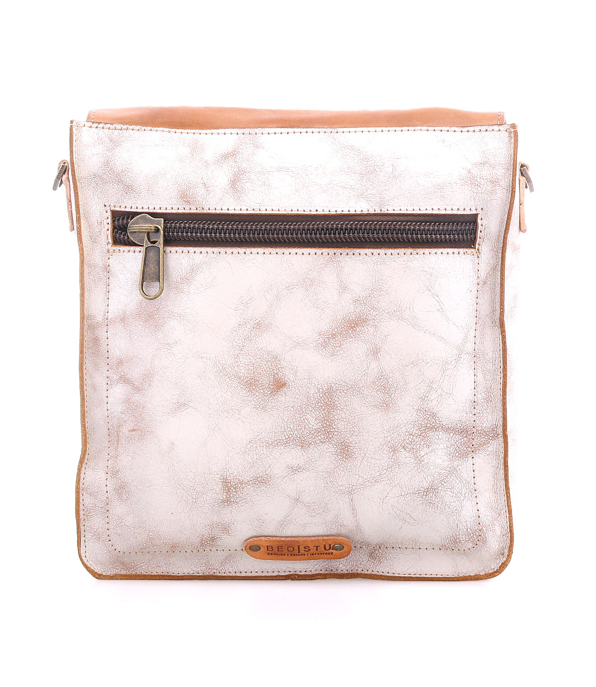 The Bed Stu Venice Beach is a square-shaped, light brown full-grain leather crossbody bag featuring an adjustable strap, front zipper pocket, and a small brown brand tag near the bottom.