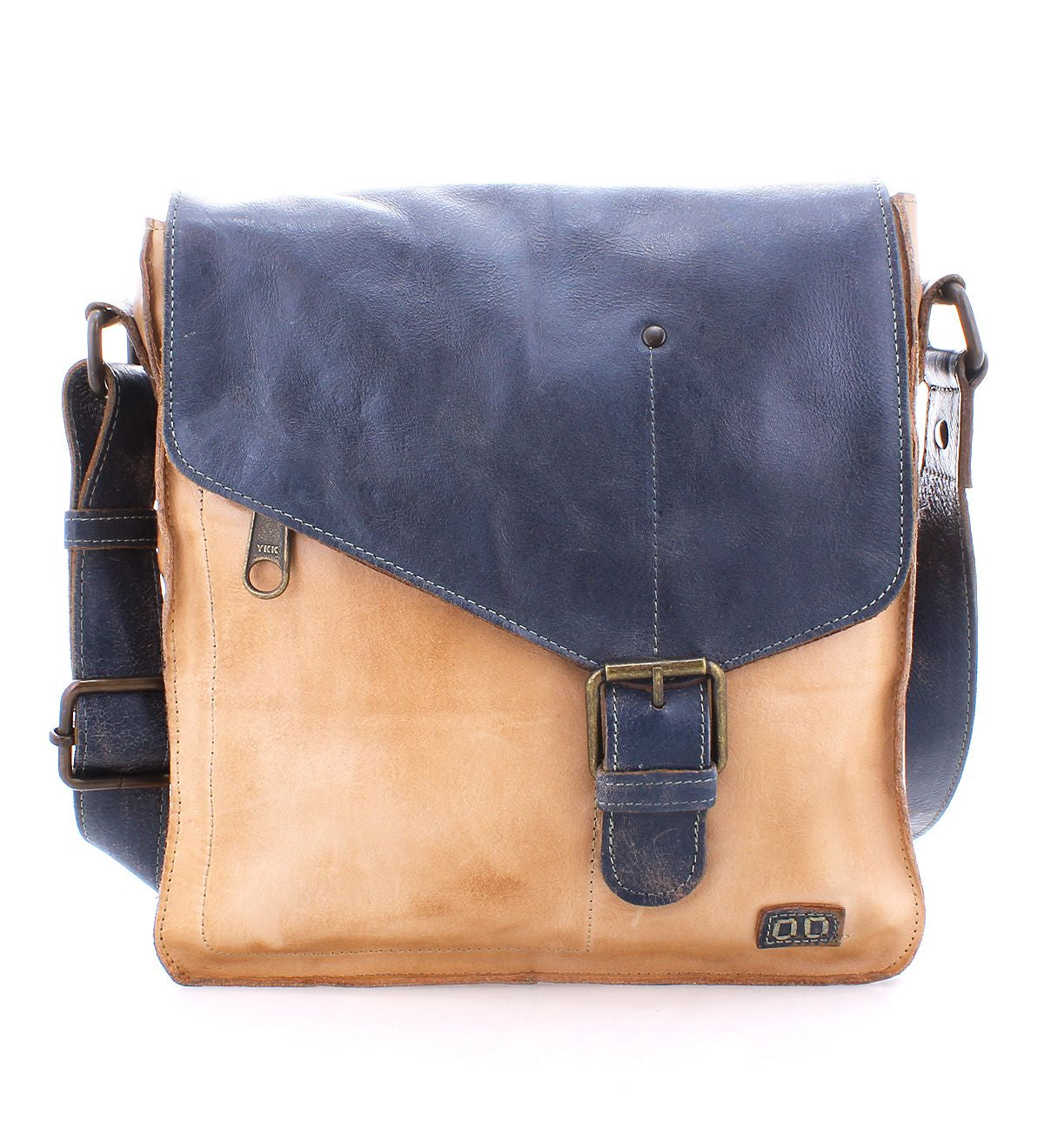 The Venice Beach by Bed Stu is a two-tone, handmade leather crossbody bag, featuring a dark blue flap and beige body. It includes a buckle closure and an adjustable strap. With its bohemian-inspired design, this bag highlights quality craftsmanship, making it both stylish and practical.