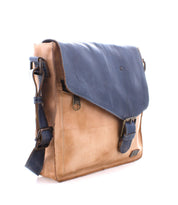 The Venice Beach by Bed Stu is a handmade leather crossbody bag featuring a tan body, a blue flap, an adjustable shoulder strap, quality craftsmanship, and a front clasp.