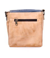 Discover the Venice Beach by Bed Stu: a handmade leather crossbody bag featuring a bohemian-inspired design with an eye-catching two-tone blue top and tan body. It showcases quality craftsmanship, includes a front zippered pocket for convenience, and offers a comfortable shoulder strap for easy carrying.