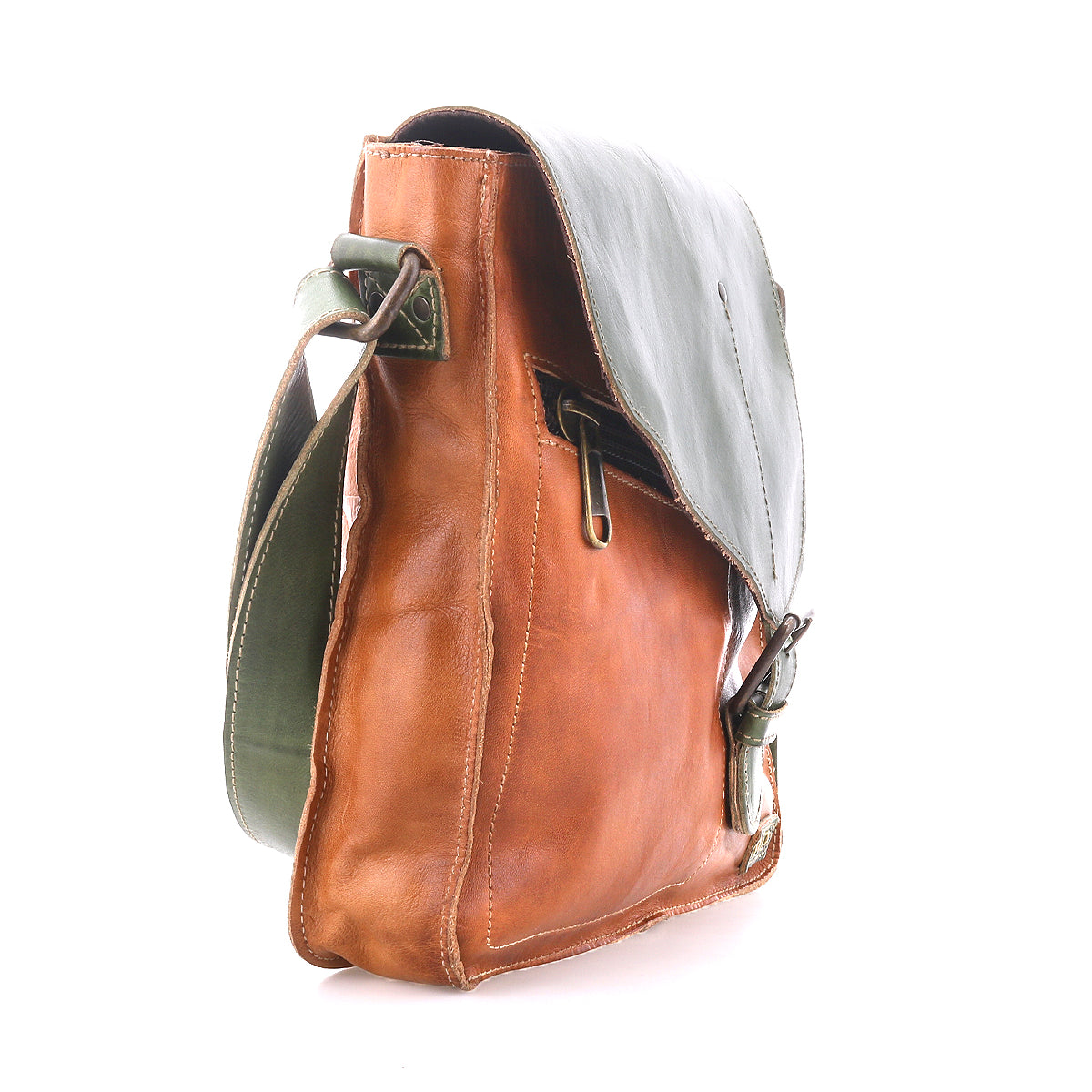 The Bed Stu Venice Beach is a handmade brown leather crossbody bag with a green bohemian-style flap and strap, displayed side-on against a white background.