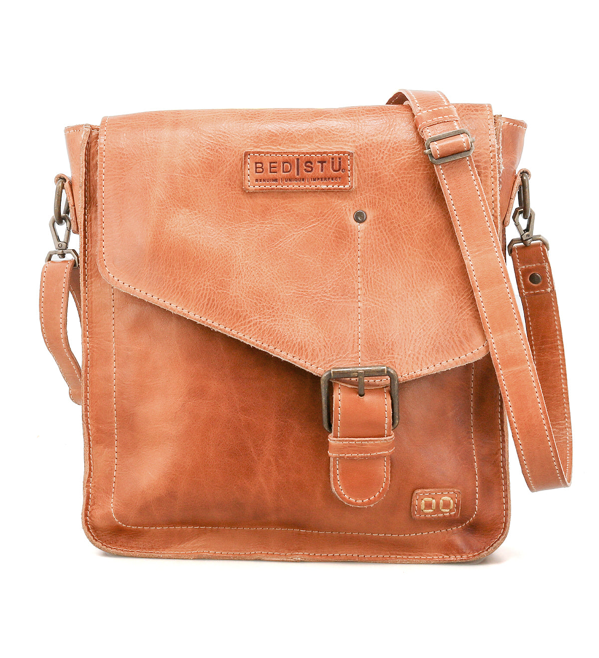 The Venice Beach crossbody bag by Bed Stu is handmade from light brown leather, featuring a front flap with buckle closure, adjustable shoulder strap, and the "Bed Stu" logo embossed on the front for a boho-inspired look.