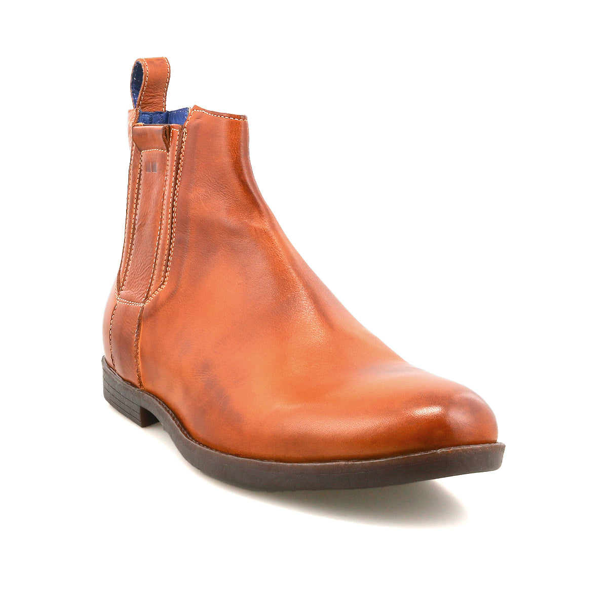 The Verrocchio by Bed Stu is a men's brown Chelsea boot made from genuine leather, featuring a low heel, black outsole, side elastic panel, and a blue pull tab for easy slip-on wear.