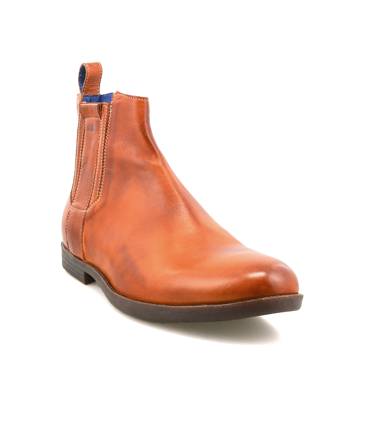 The Verrocchio by Bed Stu is a men's brown Chelsea boot made from genuine leather, featuring a low heel, black outsole, side elastic panel, and a blue pull tab for easy slip-on wear.