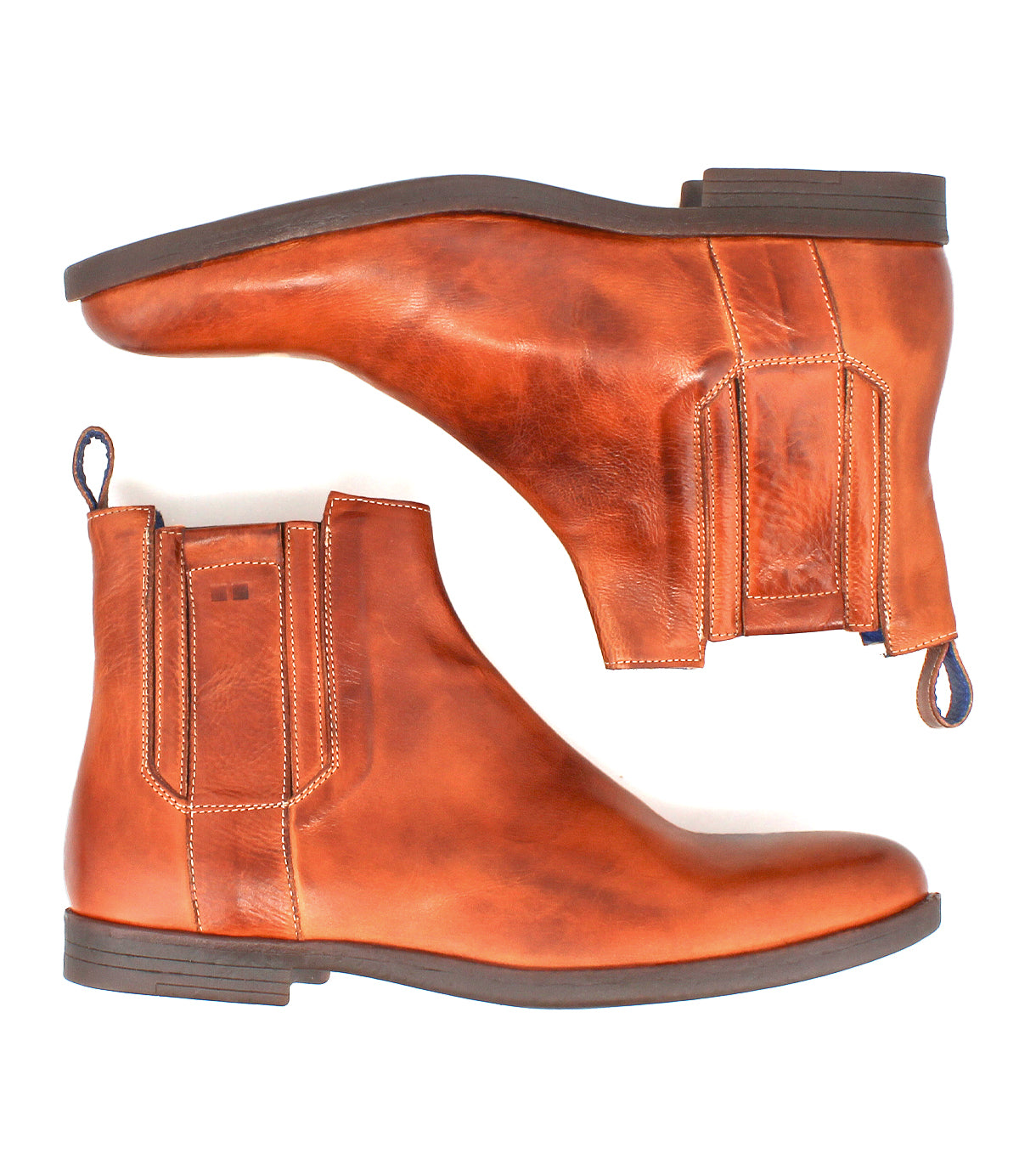 The Bed Stu Verrocchio is a pair of brown genuine leather Chelsea boots with elastic side panels, decorative stitching, pull tabs, and flat dark soles—stylish slip-ons for men shown from the side and bottom.