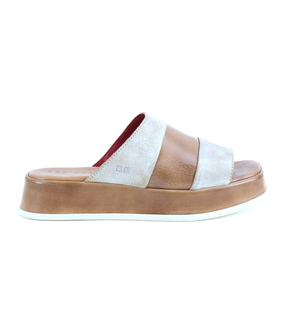 The Bed Stu Vext is a brown and beige platform slide sandal with bold color blocking, wide straps, and a thick leather-wrapped sole, shown from the side against a white background.