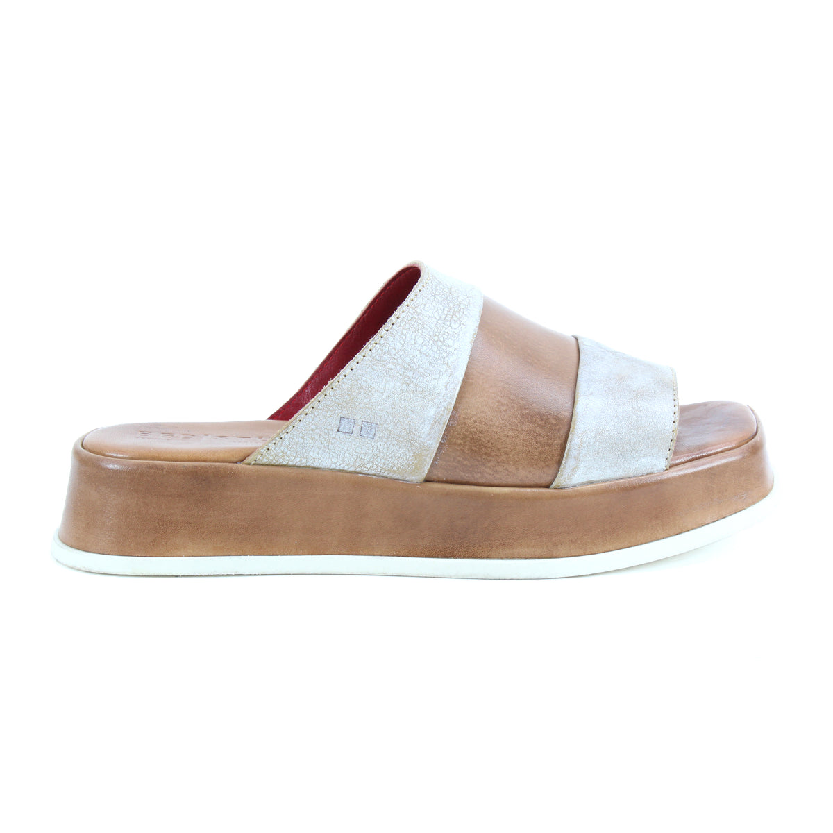 The Bed Stu Vext is a brown and beige platform slide sandal with bold color blocking, wide straps, and a thick leather-wrapped sole, shown from the side against a white background.