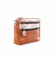 A two-toned Bed Stu Viana II leather crossbody bag with two zippered exterior pockets.