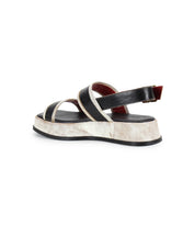 The Bed Stu Vice sandal features black and white crisscross straps, an adjustable ankle strap, and a platform sole, displayed against a white background.