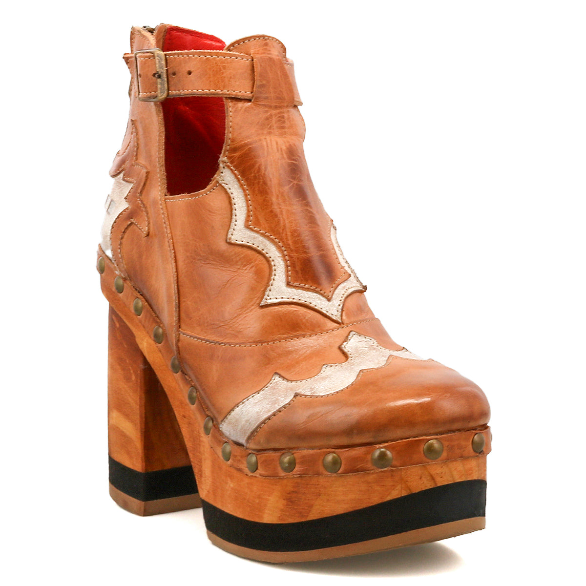 The Bed Stu Viretta is a tan leather platform boot with a chunky handcrafted wooden heel, decorative stitching, silver studs, and a side buckle.