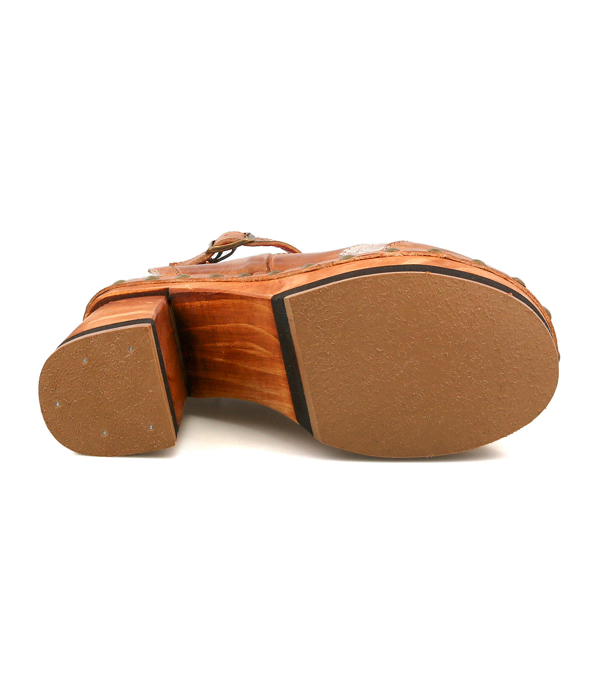 The image shows the bottom view of the Bed Stu Viretta sandal, featuring a handcrafted wooden platform, a textured sole, and a brown wooden-look heel.