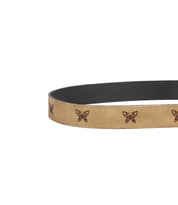 Wander tan leather belt by Bed Stu featuring laser-etched butterflies, a black inner lining, and a smooth finish.