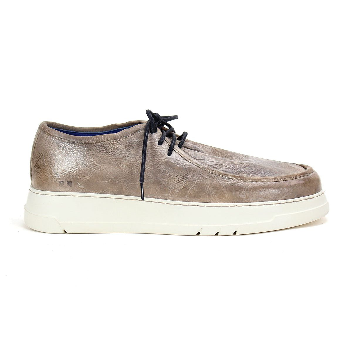The "Webmaster" sneaker by Bed Stu is designed for casual style and all-day comfort, featuring brown leather, black laces, and a white rubber sole, presented in a side view.