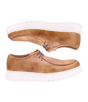 The Webmaster sneakers by Bed Stu showcase brown leather uppers paired with white soles, presented beautifully from the side and above. The dark brown laces add a classic touch while ensuring all-day comfort.