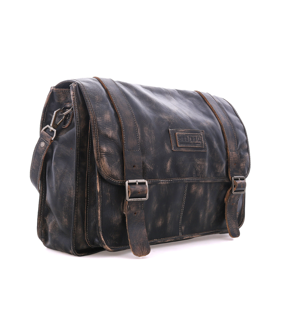 Bed|Stü Wexler spacious dark leather messenger bag with two buckled straps and a flap closure.