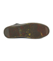The view shows the bottom sole of the Bed Stu Wizard leather sneaker, featuring a ribbed texture, slight discoloration, and "BED|STU" embossed near the center.