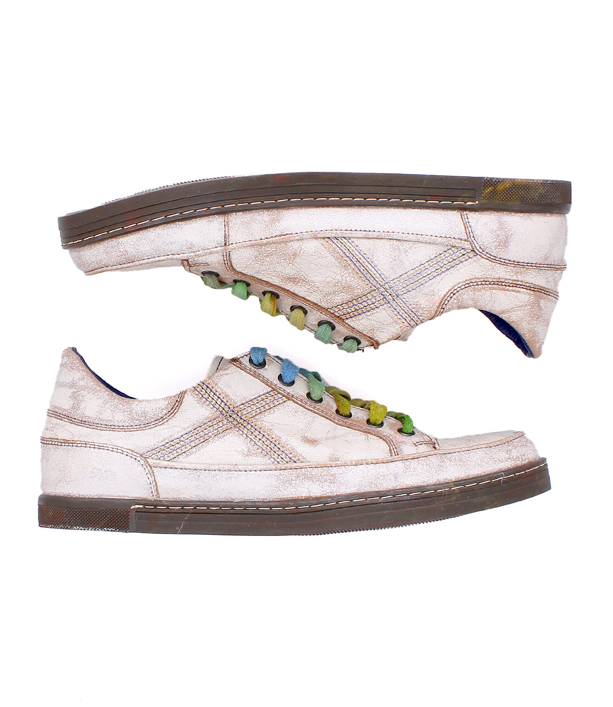 Two distressed off-white Bed|Stü Wizard low-profile sneakers with multicolored laces and crossover stitching, positioned head-to-toe against a white background.