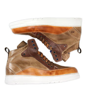 A pair of Bed Stu Workbench men’s brown high-top sneakers with white soles, blue eyelets, cushioned rubber sole, and back pull tabs are displayed side by side on a white background.