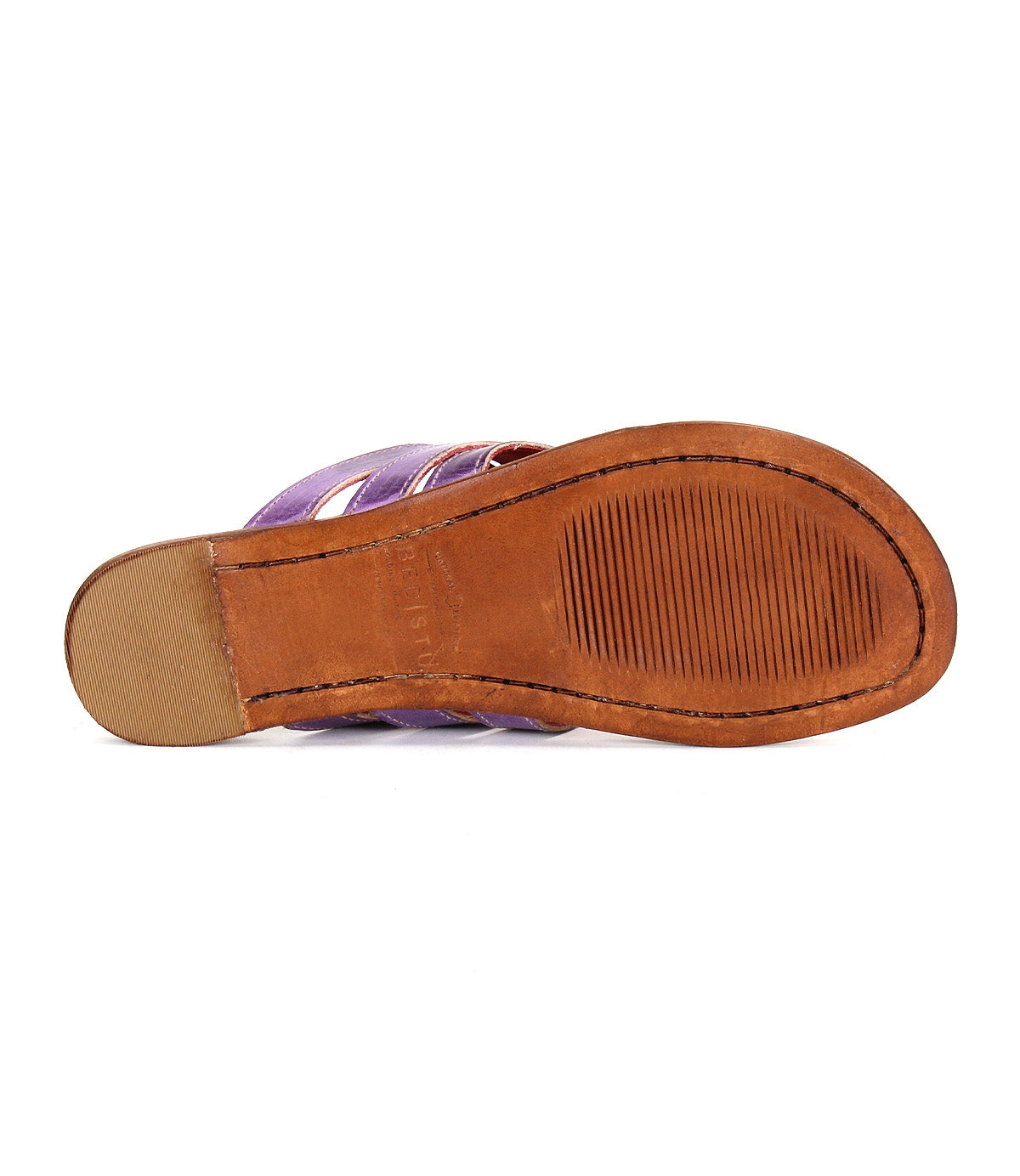 Bottom view of the Bed Stu Yoli sandal shows a brown leather sole with textured grooves for grip and a small patch on the heel.