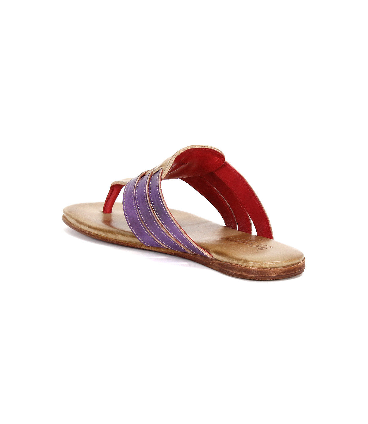 The Bed Stu Yoli is a flat leather thong sandal with a tan sole, red foot strap, purple and tan woven leather sides, and a cushioned insole for all-day comfort.