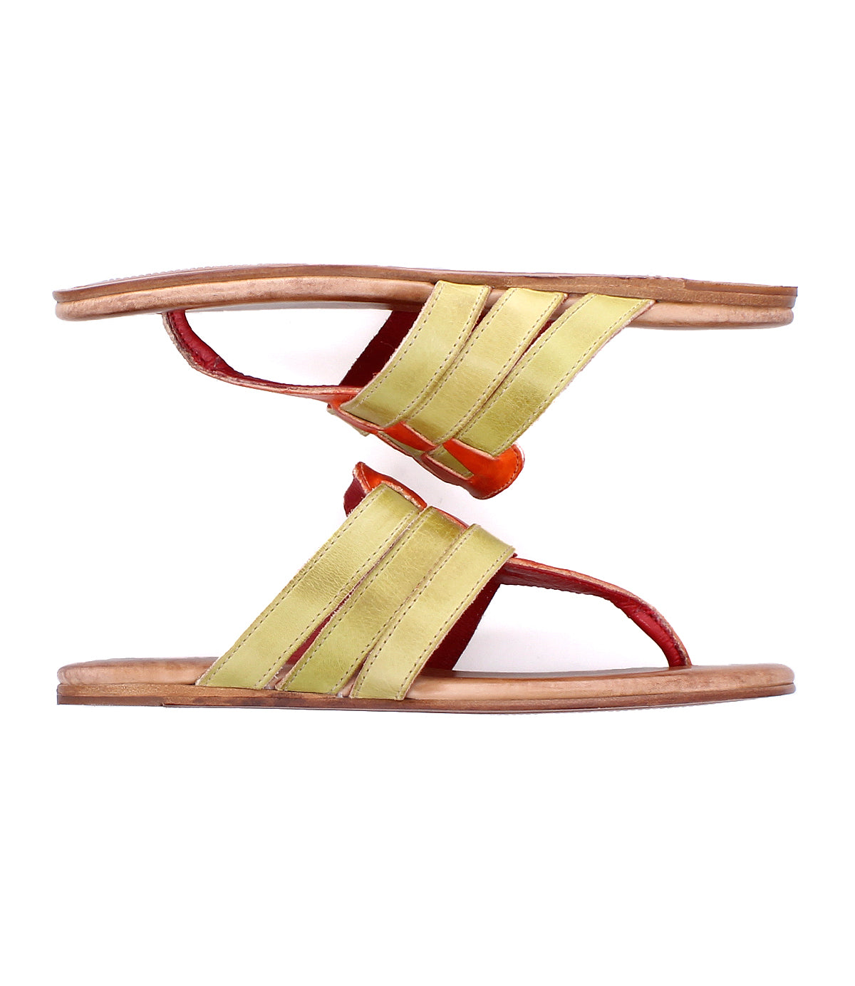 The Yoli sandals from Bed Stu feature brown leather soles with vibrant yellow and red leather straps. Positioned artfully against a white background, these stylish sandals ensure comfort with their cushioned insoles.