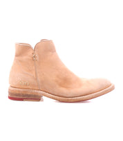 The Yurisa by Bed Stu is a light tan leather ankle boot with a low heel, visible stitching, and a slightly worn Vibram outsole—shown in side profile and ideal as your everyday go-to.