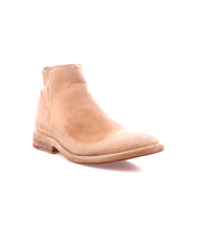 The Bed Stu Yurisa is a tan leather ankle boot with a rounded toe, visible stitching, low stacked heel, and durable Vibram outsole—an ideal everyday choice. Shown here against a white background.