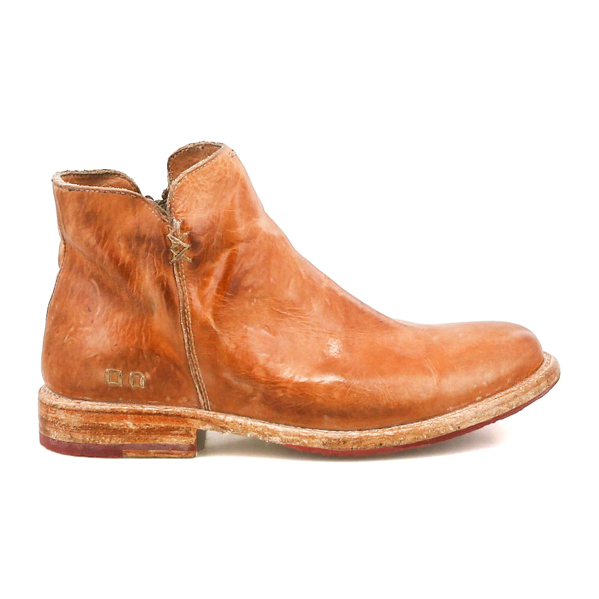 The Yurisa by Bed Stu is a brown leather ankle boot with visible creases, a slight heel, and a scuffed Vibram outsole—shown in profile against a white background, making it an ideal everyday choice.