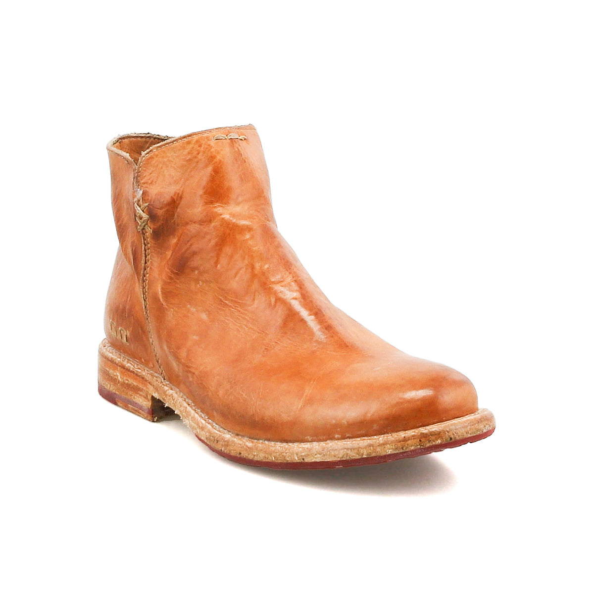 The Bed Stu Yurisa is a light brown leather ankle boot with a round toe, red leather lining, visible stitching, and a low stacked heel—an ideal everyday style.