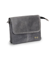 The Ziggy by Bed Stu is a small, rectangular gray leather crossbody with a flap closure, visible stitching, and two metal rivet accents—ideal for keeping your essentials stylishly at hand.