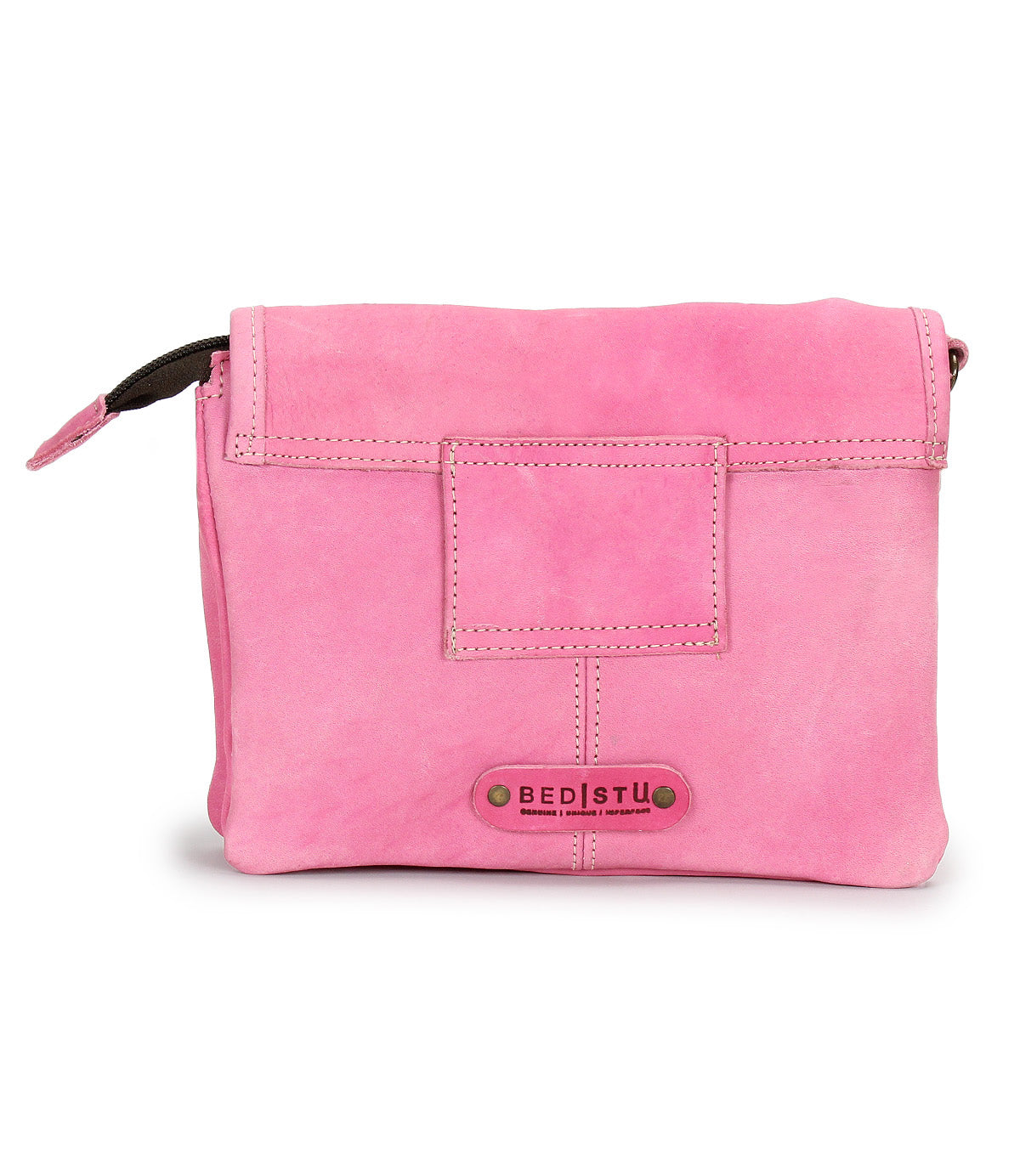 The Ziggy by Bed Stu is a pink leather crossbody bag featuring a front flap closure and a small rectangular patch above its metal-studded logo—perfect for stylish convenience on the go.