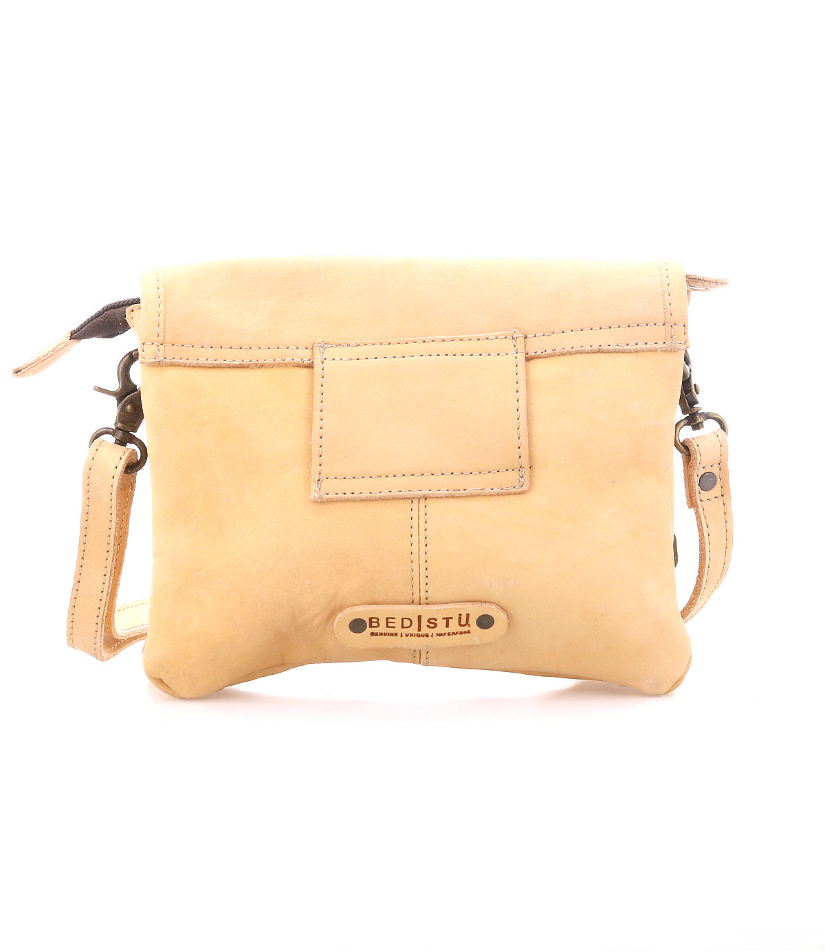 The Ziggy by Bed Stu is a tan leather crossbody bag featuring a front pocket, adjustable strap, and a metal Bed Stu logo plate—perfect for hands-free convenience on your daily adventures.
