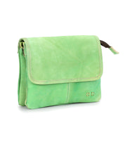 The Bed Stu Ziggy is a small, rectangular light green leather crossbody bag with a flap closure and subtle stitching—an effortlessly stylish, versatile accessory for any outfit.