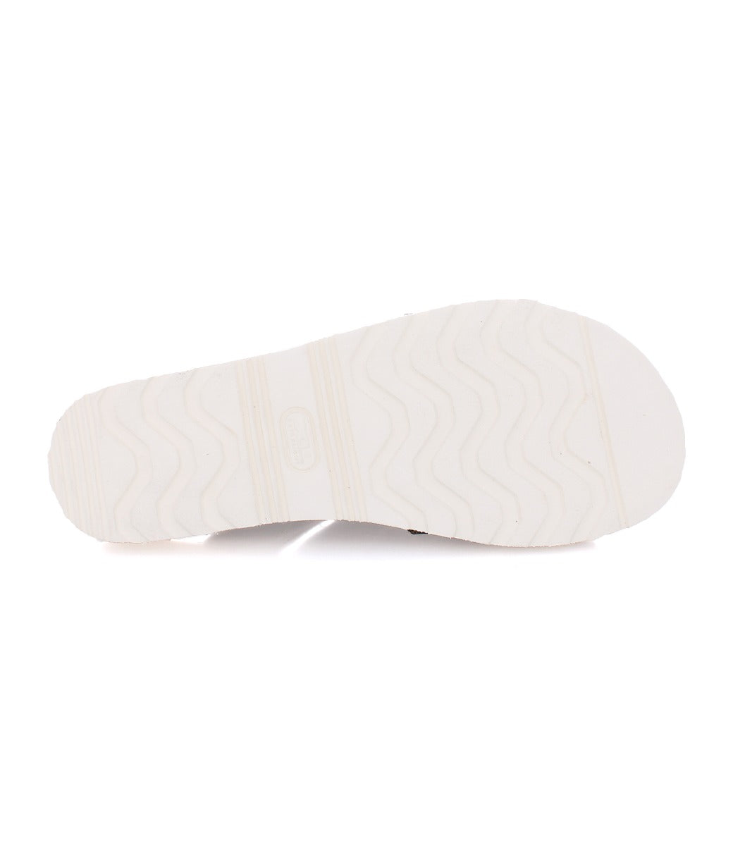 Bottom view of a Bed Stu Abraham Light slide sandal with a white rubber sole featuring wavy lines and a rectangular logo in the center.