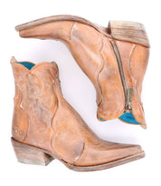 A stylish pair of Bed Stu Ace cowboy boots on a white background.