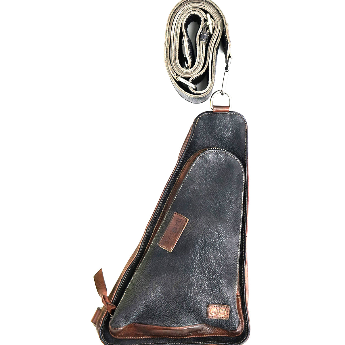 A versatile crossbody bag, the Bed Stu Adept, this black and brown leather sling is displayed vertically with the strap coiled neatly on top, making it an ideal travel companion.