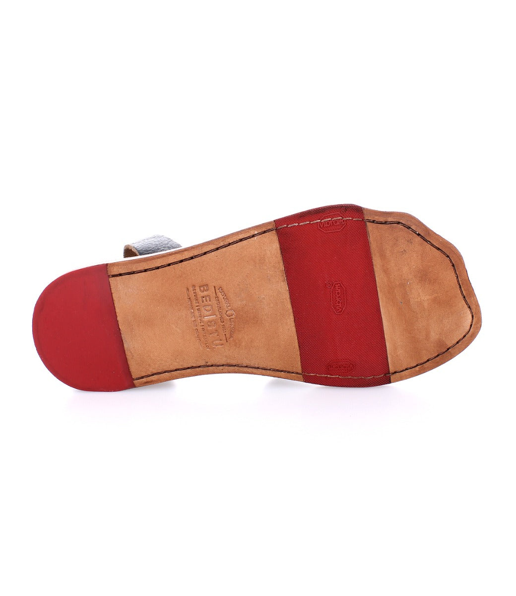 The back of a woman's Afrodita shoe with red and black stripes, by Bed Stu.